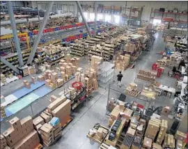  ?? Gary Friedman Los Angeles Times ?? STATES and counties say they lose billions each year because they cannot collect sales taxes on all online purchases. Above, a warehouse for online retailer Newegg.