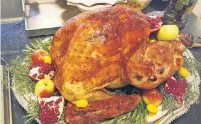  ??  ?? This “presentati­on turkey” by chef Mazzu Kirstein is for photos and leftovers — not actual Thanksgivi­ng dinner.