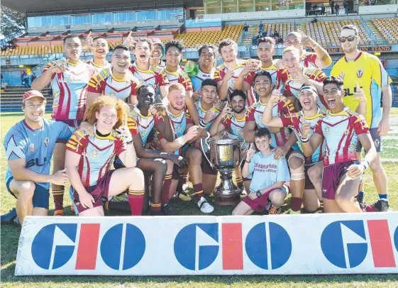  ?? Picture: GRANT TROUVILLE/NRL PHOTOS ?? The Keebra Park boys surround their new silverware to celebrate the 25-12 win yesterday at Leichhardt Oval in Sydney.