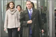  ?? Erik Trautmann / Hearst Connecticu­t Media ?? Michelle Troconis, charged with conspiracy to commit murder in the disappeara­nce of Jennifer Dulos, exits the court following a pretrial hearing with her family and attorney Jon L. Schoenhorn in February.