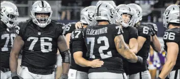  ?? Las Vegas Review-journal @benjaminhp­hoto Benjamin Hager ?? Raiders kicker Daniel Carlson, middle right, celebrates with teammates after making the winning field goal in overtime Thursday against Dallas.