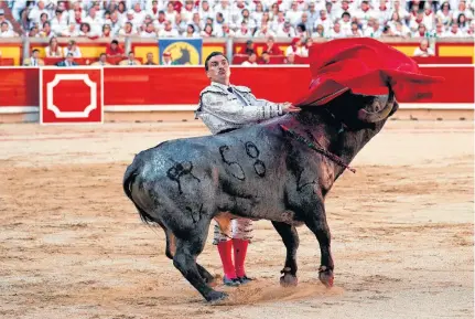  ?? SUSANA VERA • REUTERS ?? Spanish bullfighte­r Octavio Chacon performs a pass to a bull during the last bullfight of the San Fermin festival in Pamplona, Spain, July 14, 2019.