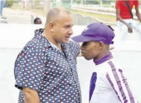  ?? (Photo: Karl Mclarty) ?? Jockey Tevin Foster (right) and trainer Jason Dacosta discussing riding strategies before the first race on Sunday, April 14, 2024. Foster won aboard Dancing Aviator for Dacosta.