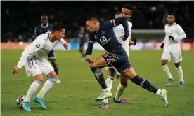  ?? Photograph: Dave Winter/Rex/Shuttersto­ck ?? Kylian Mbappé bursts between Lucas Vázquez and Éder Militão to score PSG’s late winner against Real Madrid.