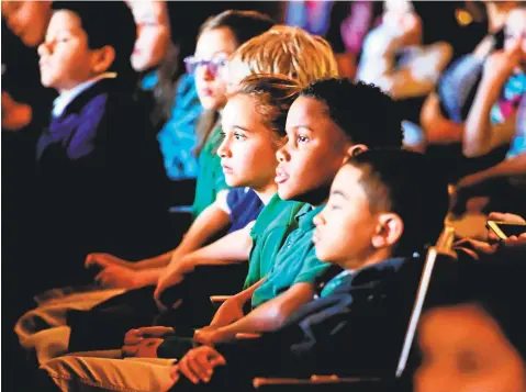  ?? File photo ?? Children listen to the New Haven Symphony Orchestra during a NHSO Young People's Concert at Yale University's Woolsey Hall.