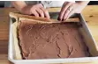  ??  ?? Roll the sponge cake covered with salted milk chocolate ganache into a roulade shape.