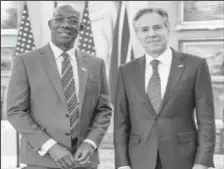  ?? ?? JOINING FORCES: Prime Minister Dr Keith Rowley, left, and US Secretary of State Antony Blinken pose for a photo following their meeting on Monday at the State Department in Washington, DC. —Photo: Office of The Prime Minister