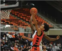  ?? KYLE FRANKO — TRENTONIAN PHOTO ?? Princeton’s Xaivian Lee (4) lays the ball in the basket against Monmouth during a NCAA men’s basketball game at Jadwin Gymnasium.