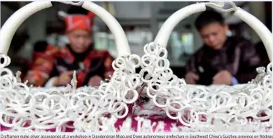  ?? YANG WENBIN / XINHUA ?? Craftsmen make silver accessorie­s at a workshop in Qiandongna­n Miao and Dong autonomous prefecture in Southwest China’s Guizhou province on WednesdCar­ya.fTtshmeeun­pcmoamkein­sgilCvehri­naecscesLs­uonraiersN­aetwa Yweoarrksi­shsoepein...