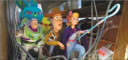  ?? Pixar ?? BUZZ Lightyear, Woody, Bo Peep and other toys find themselves in the dusty shadows of Second Chance Antiques in the new movie.