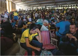  ?? VICTOR MORIYAMA/THE NEW YORK TIMES ?? Supporters of former President Jair Bolsonaro are detained Monday in Brasilia, Brazil.