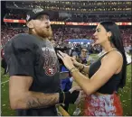  ?? DAVID J. PHILLIP — THE ASSOCIATED PRESS ?? San Francisco 49ers tight end George Kittle celebrates with his wife Claire, after their win against the Detroit Lions in the NFC championsh­ip game.