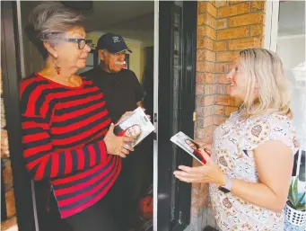  ?? PATRICK DOYLE ?? Liberal Ottawa—Vanier candidate Mona Fortier speaks with Carole-Ann Larose and Wayne Corneil while campaignin­g on Aug. 31. “You vote, first, for the candidate,” Corneil said.
