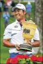  ?? AKRON BEACON JOURNAL ?? Hideki Matsuyama seizes the trophy with a 61 capped by three straight birdies.