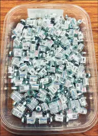  ?? Kateland Kelly / Contribute­d photo ?? A tub is filled with vials representi­ng 1,112 vaccinatio­ns which were administer­ed at the John Pettibone Community Center clinic in New Milford.
