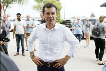  ?? CHARLIE NEIBERGALL — THE ASSOCIATED PRESS ?? In this file photo, Democratic presidenti­al candidate Pete Buttigieg talks with attendees at the Hawkeye Area Labor Council Labor Day Picnic in Cedar Rapids, Iowa.