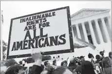  ?? SUSAN WALSH/AP PHOTO ?? Protesters gather Tuesday outside the Supreme Court in Washington, where the Supreme Court is hearing arguments in the first case of LGBTQ rights since the retirement of Supreme Court Justice Anthony Kennedy.