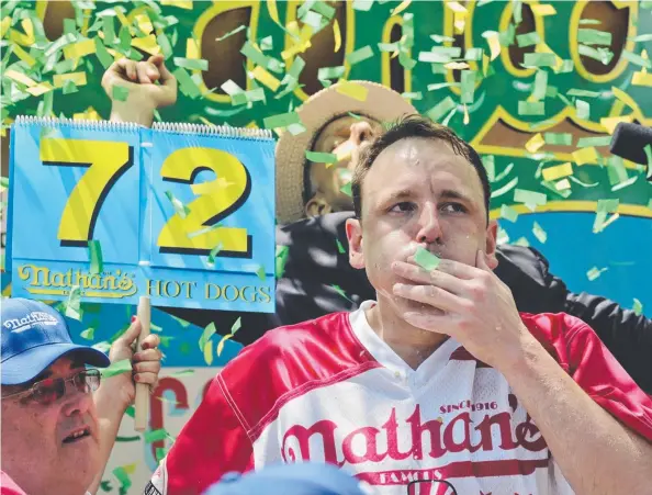  ?? Picture: AP ?? FAST FOOD: Joey Chestnut wins the Nathan’s Famous Internatio­nal Hot Dog Eating Contest, marking his 10th victory in the event.