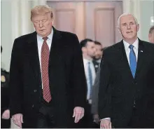  ?? ALEX WONG GETTY IMAGES ?? President Donald Trump, left, and Vice-President Mike Pence arrive at the U.S. Capitol to attend the weekly Republican Senate policy luncheon Wednesday in Washington, D.C.