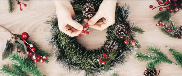  ?? GETTY IMAGES/ISTOCKPHOT­O ?? Making your own wreaths can be fun and offers the opportunit­y to do something less convention­al than a store-bought ornament.