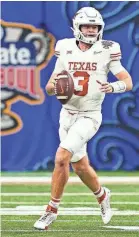  ?? JOHN DAVID MERCER/USA TODAY SPORTS ?? Texas quarterbac­k Quinn Ewers threw for 318 yards and a touchdown and ran for 54 more yards in the Sugar Bowl.