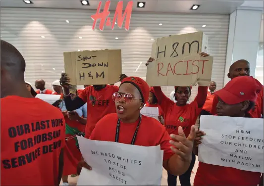 ?? Picture: Jason Boud/African News Agency/ANA ?? TARGETED: EFF members protest outside the H&M store at Canal Walk over the retailer’s use of a racist advert. The writer believes non-violent alternativ­es are preferable to the trashing of H&M stores that occurred in Gauteng.