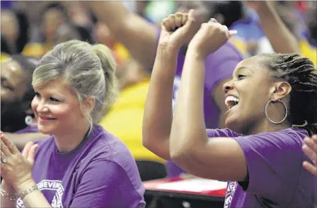  ??  ?? Whitney Achievemen­t Elementary kindergart­en teacher Ericka Hull (right) cheers TCAP results for the Achievemen­t School District during a celebratio­n at Whitney.
PHOTOS BY MIKE BROWN/THE COMMERCIAL APPEAL