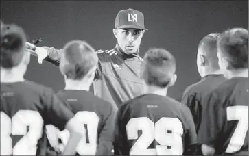  ?? Michael Owen Baker
For The Times ?? JOEY CASCIO trains more than two dozen youngsters three nights a week at Cal State Los Angeles.