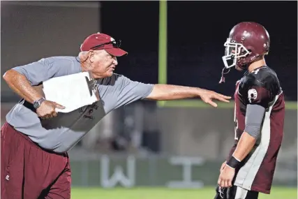  ?? ROD MILLINGTON ?? Riverview High's John Sprague, seen directing Ram quarterbac­k Travis Tritschler in a game from 2009, spent 30 years as the Rams' head football coach.
