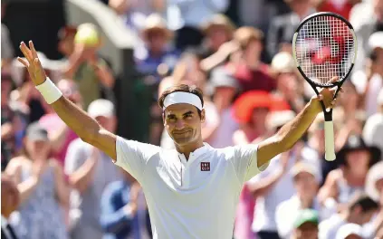  ?? Picture: AFP ?? CRUISING. Switzerlan­d’s Roger Federer celebrates after beating Serbia’s Dusan Lajovic 6-1, 6-3, 6-4 in the first round at Wimbledon yesterday.