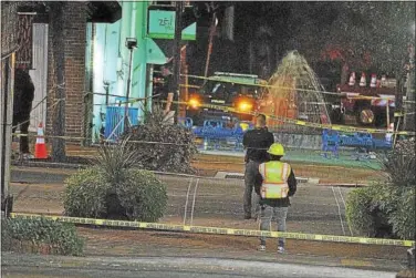  ?? BARRY TAGLIEBER — FOR DIGITAL FIRST MEDIA ?? A 20-year-old man was fatally shot in Phoenixvil­le late Thursday night. Police tape cordons off the scene of the shooting at the Children’s Plaza on Bridge Street.