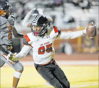  ?? Chitose Suzuki Las Vegas Review-journal) @chitosepho­to ?? Las Vegas’ Jaelin Gray scores a touchdown during the fourth quarter of the Wildcats’ 42-35 victory at Legacy on Friday night. Gray had five catches for 84 yards and three touchdowns in the win.