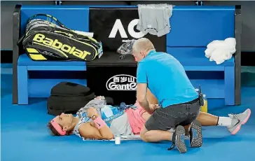  ?? DARRIAN TRAYNOR/ GETTY IMAGES ?? Rafael Nadal receives treatment.