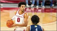  ?? (Special to the NWA Democrat-Gazette/David Beach) ?? University of Arkansas forward Justin Smith (left), shown in a victory against Southern last month, had surgery on his right ankle Friday and is expected to miss three to six weeks.