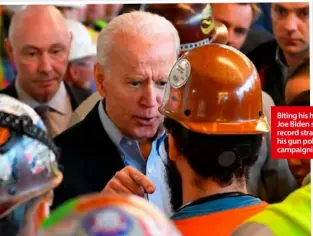  ??  ?? Biting his head off: Joe Biden sets the record straight on his gun policy while campaignin­g.