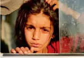  ?? — AP ?? A Syrian girl displaced by the Turkish military operation in northeaste­rn Syria, is seen weeping.