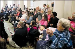  ?? Arkansas Democrat-Gazette/THOMAS METTHE ?? People applaud a speaker Saturday during the ninth annual Rally for Reproducti­ve Justice held in the Old Supreme Court Room at the state Capitol in Little Rock.