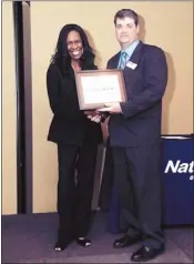  ??  ?? Patrenna Hancock (left), chairman of the Business Department for the Memphis campus of National College of Business & Technology, was presented with the Distinguis­hed Teaching Award and was recognized as one of the outstandin­g employees of the year for...