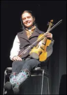  ??  ?? Fiddler Brigid Reedy played musical interludes at The Moth Mainstage during the National Cowboy Poetry Gathering.