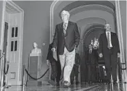  ?? Ting Shen/Bloomberg ?? Senate Minority Leader Mitch McConnell, R-Ky., walks through the Capitol on Saturday as Democrats look to pass their tax and climate bill.
