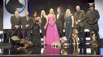  ?? Dan Steinberg/ Invision for American Humane/ AP ?? Fox Chapel native Beth Stern, in the pink gown, hosted the 2018 American Humane Hero Dog Awards show in Beverly Hills, Calif. The 2020 show will air Monday on Hallmark Channel.