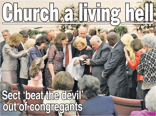  ??  ?? BAD FAITH: Word of Faith leader Jane Whaley holds a baby among followers in Spindale, NC, in 2012. Ex-members say they were abused.