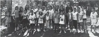  ??  ?? ROOP. The Run Out Of Poverty (ROOP) kids with Olympian Tony Benson, Stax Savellano and Barangay Langub officials pose during the launching of Barangay Langub Fitness Program dubbed as "Bawal Magkasakit", a walk-jog-run program towards better health in...