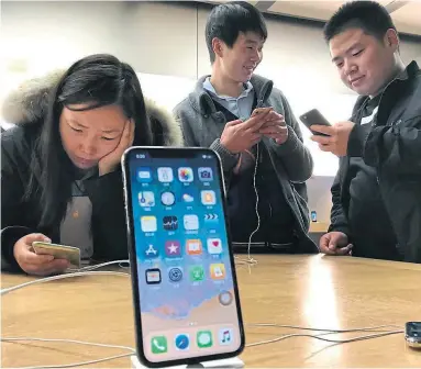  ?? NG HAN GUAN/THE ASSOCIATED PRESS FILE PHOTO ?? “Gambling apps are illegal and not allowed on the App Store in China,” Apple said in an emailed statement.