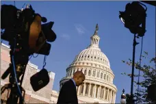  ?? T.J. KIRKPATRIC­K / NYT ?? A TV crew sets up outside the Capitol on Wednesday. House Speaker Nancy Pelosi (D-Calif.) announced Tuesday the House would launch an impeachmen­t inquiry.