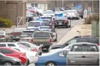  ?? PHOTO BY RYAN HERMENS/THE PADUCAH SUN VIA AP ?? Emergency crews respond to Marshall County High School after a fatal school shooting Tuesday in Benton, Ky. Authoritie­s said a shooting suspect was in custody.