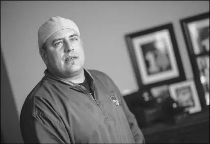  ?? CP PHOTO ?? Autoworker Mike Malott poses for a photo in his Windsor, Ont., home.