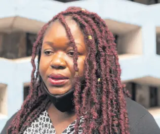  ?? FILE ?? Sherine Virgo speaks with the media outside the Supreme Court in Kingston on Friday, July 31, 2020 following the verdict in a case where her child was denied attending Kensington Primary School as a result of having dreadlocke­d hair in 2018. The court ruled that the action was not unconstitu­tional.