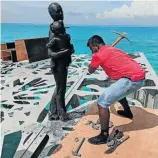  ?? Picture: maldivesin­dependent.com ?? AXED A policeman breaks one of the works.