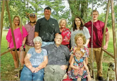  ?? PHOTOS BY CAROL ROLF/CONTRIBUTI­NG PHOTOGRAPH­ER ?? Johnny Wayne Taylor, standing, third from left, and his wife, Jennifer Taylor, fourth from left, own and operate J&J Taylor Farms in McCrory. They are the 2019 Woodruff County Farm Family of the Year. Family members include, seated, from left, Alta and Eddie Taylor and Marlene McDonald, holding 3-year-old Lanie Paige McElyea; and standing, Morgan Simmons, Zac McDonald, Melanie McElyea and Caleb McElyea.